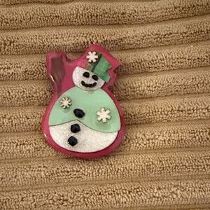 Acrylic Snowman Brooch with Red and Green accents.